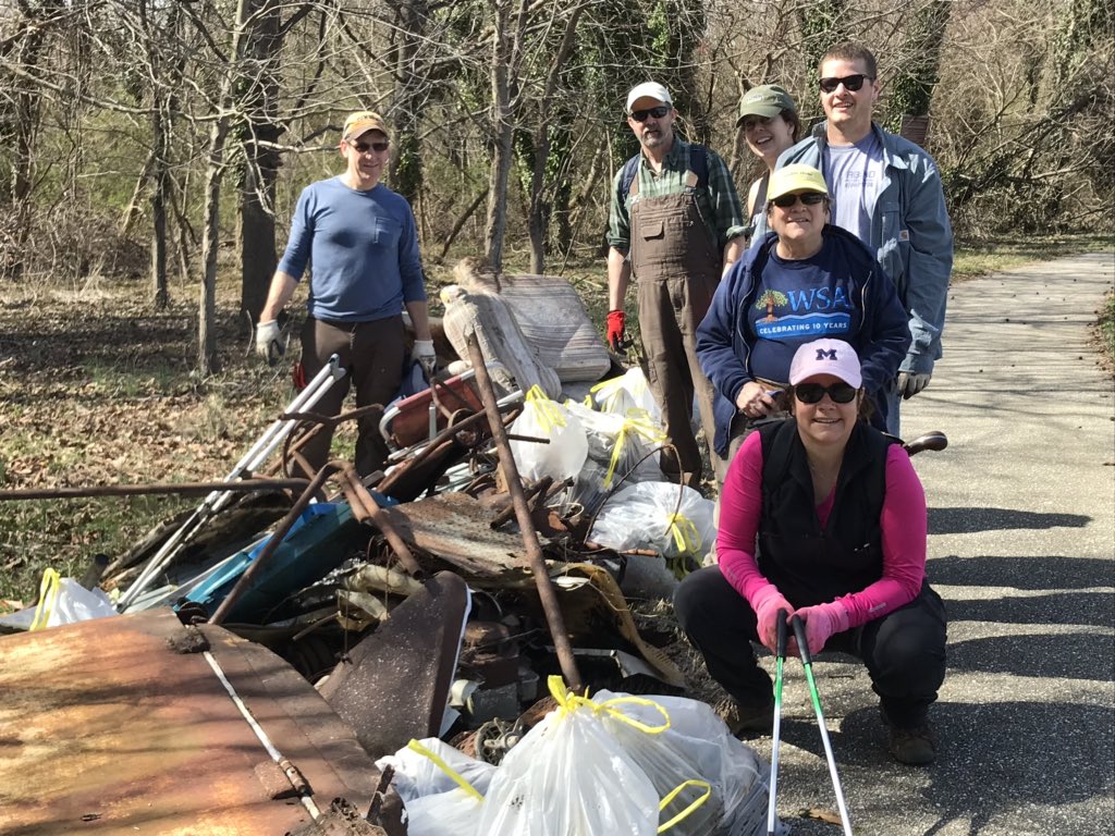 A mighty group of volunteers pulled out 100 bags of trash plus a sofa, fridge, lawnmower and stove from the banks of the Spa Creek headwaters