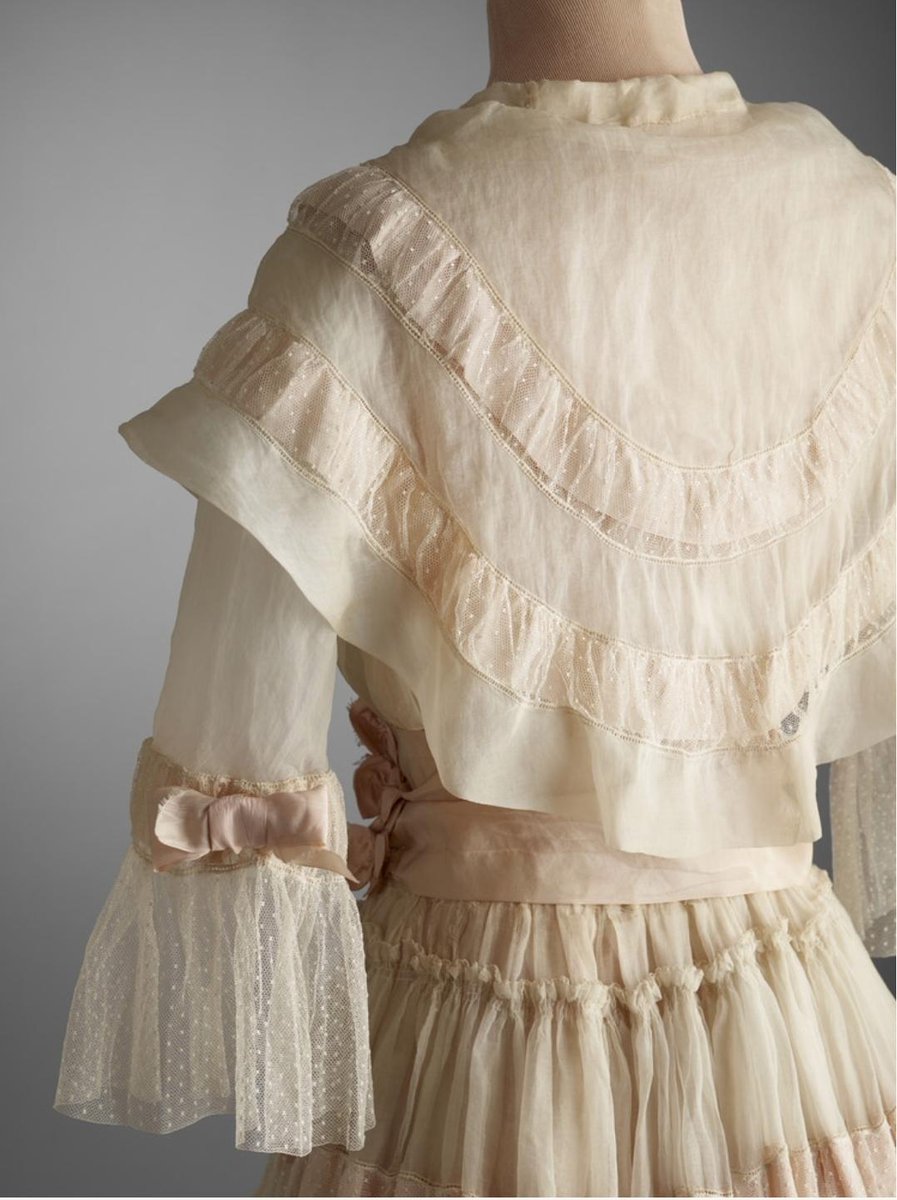 Happy #MerriweatherMonday everyone! This week's outfit is a 1917-20 afternoon tea dress. It is basically as traditionally feminine as you can get with tiered pink silk ribbons over spotted tulle. Perfect for a spring afternoon tea! <a href="/HillwoodMuseum/">Hillwood Museum DC</a> #FashionHistory
