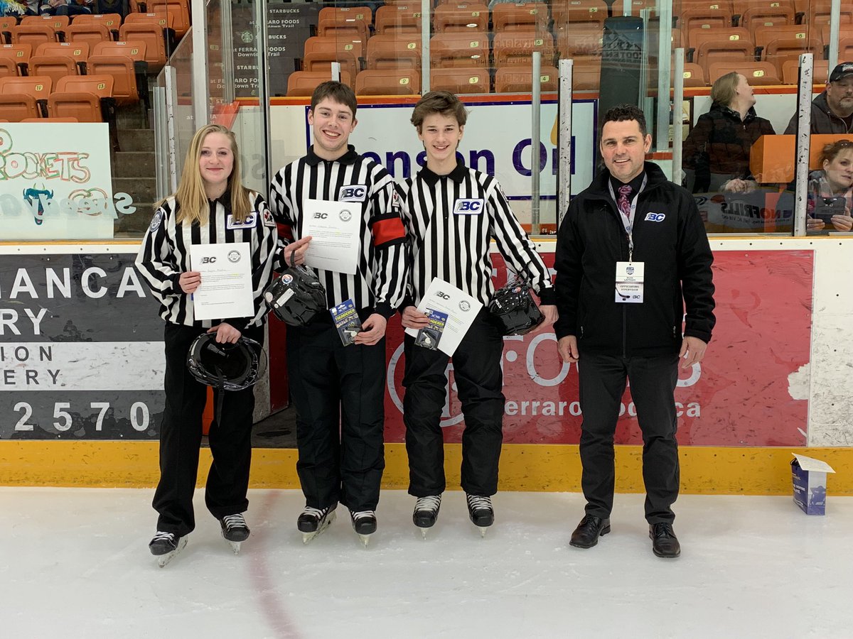 WKD_Referees's tweet photo. Gold medal game at the 2019 PeeWee Female Championships in Trail on March 24th. Lineswoman Kaylin Mackie, Referee Chayce Szabo and Linesman Spencer Dixon-Reusz being presented with their engraved Championship whistles and recognition letters by Officiating Supervisor Ross Lautard https://t.co/cdSxPutZvT