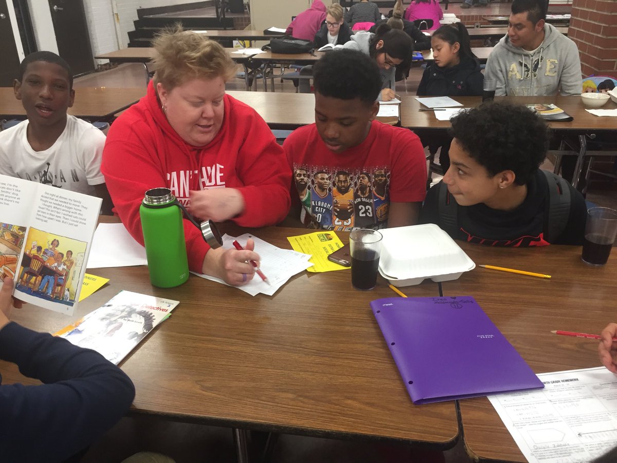 Ms.  Mabrey tutoring students with Math work!
