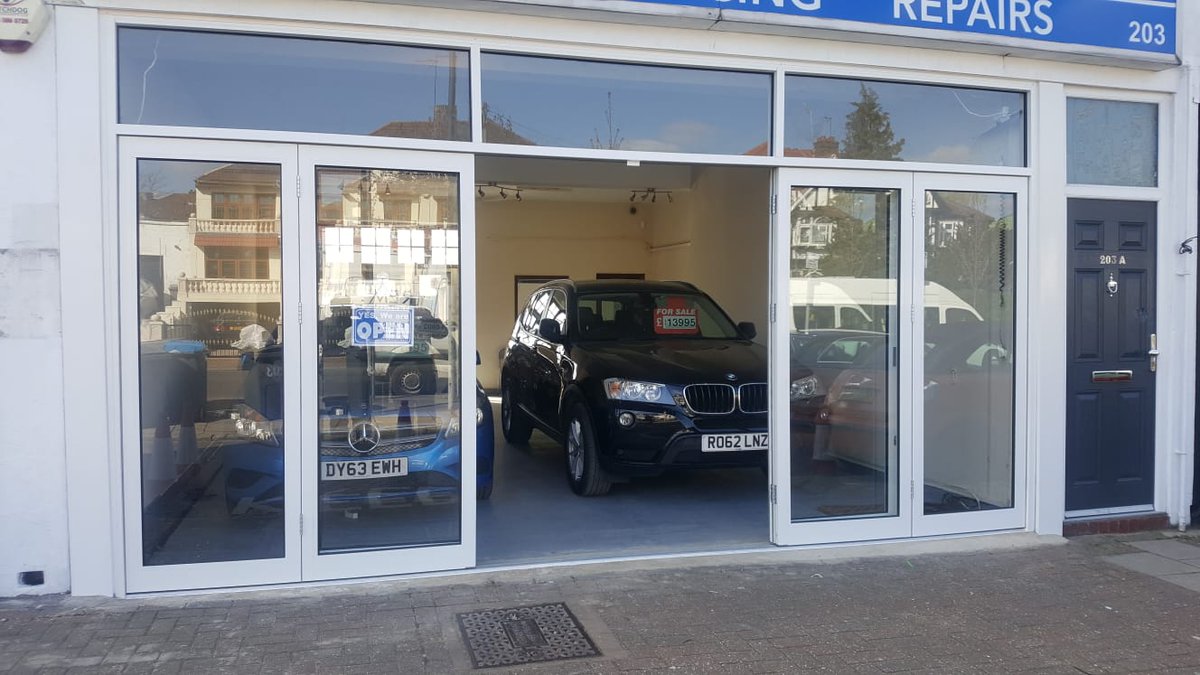 Shopfront transformation! Bi folding doors for car showroom in North London. SupremeShopfronts.com