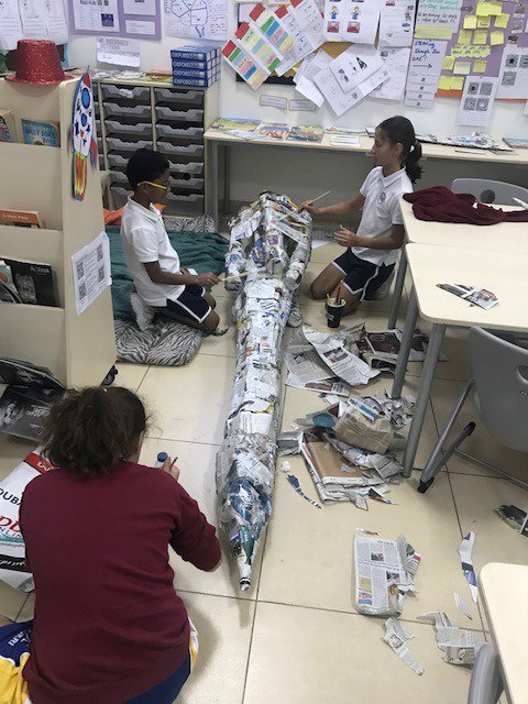 RISDXB_SCIENCE's tweet photo. A work in progress since January. 5D using their art and science skills to create a rocket from recycled water bottles and newspapers. The next step now is to code and programme the rocket. #STEAM #science #coding #art https://t.co/NgQewzdYNu