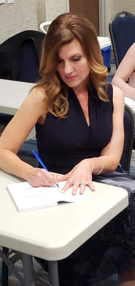 Actress <a href="/BeckBartlett/">Beck Bartlett</a> signing autographs at the press conference for the film Across the Plane.