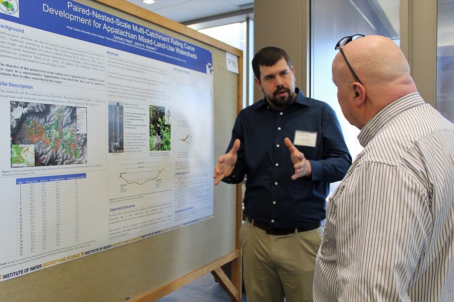 Zachary Heck, a Master's Graduate Research Assistant with the IWSS, presents a poster during today's Davis College Graduate Student Research and Creative Scholarship Day. <a href="/WVU_IWSS/">WVU Institute of Water Security and Science</a> <a href="/wvudavis/">WVU Davis College</a> <a href="/researchwv/">STaR Division</a>