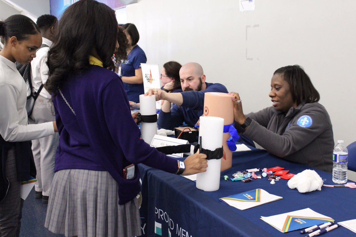 Students learning CPR and how to use a tourniquet from emergency medicine professionals <a href="/YouthForceNOLA/">YouthForce NOLA</a> Career Expo! @<a href="/JAneworleans/">Junior Achievement</a> <a href="/GNOinc/">GNO, Inc.</a>