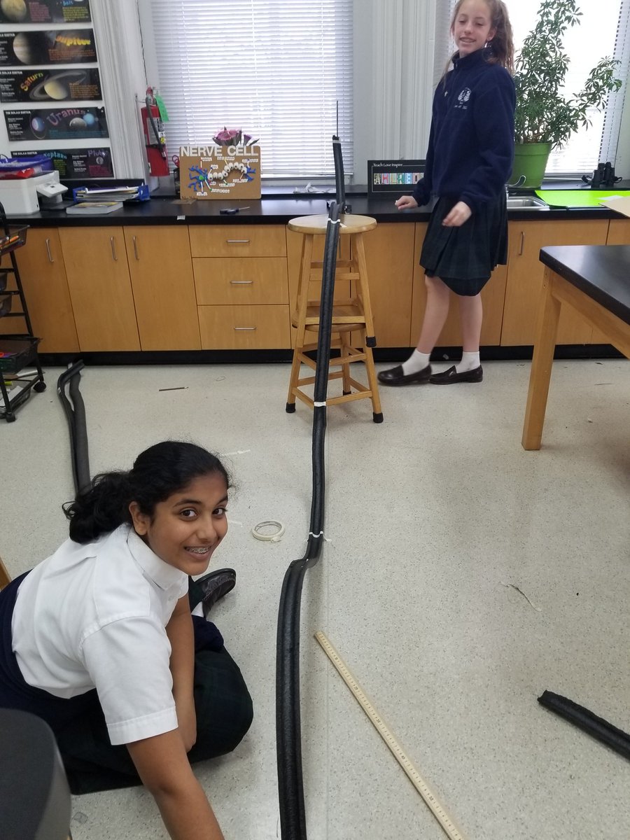 AcademySCI's tweet photo. Seventh Class are applying  concepts of force and motion by engineering rollercoasters. They are using a combination of gravity and inertia, along with g-forces and centripetal acceleration to create an exhilarating ride.  #STEM @ash1818 https://t.co/szBHhcCkga