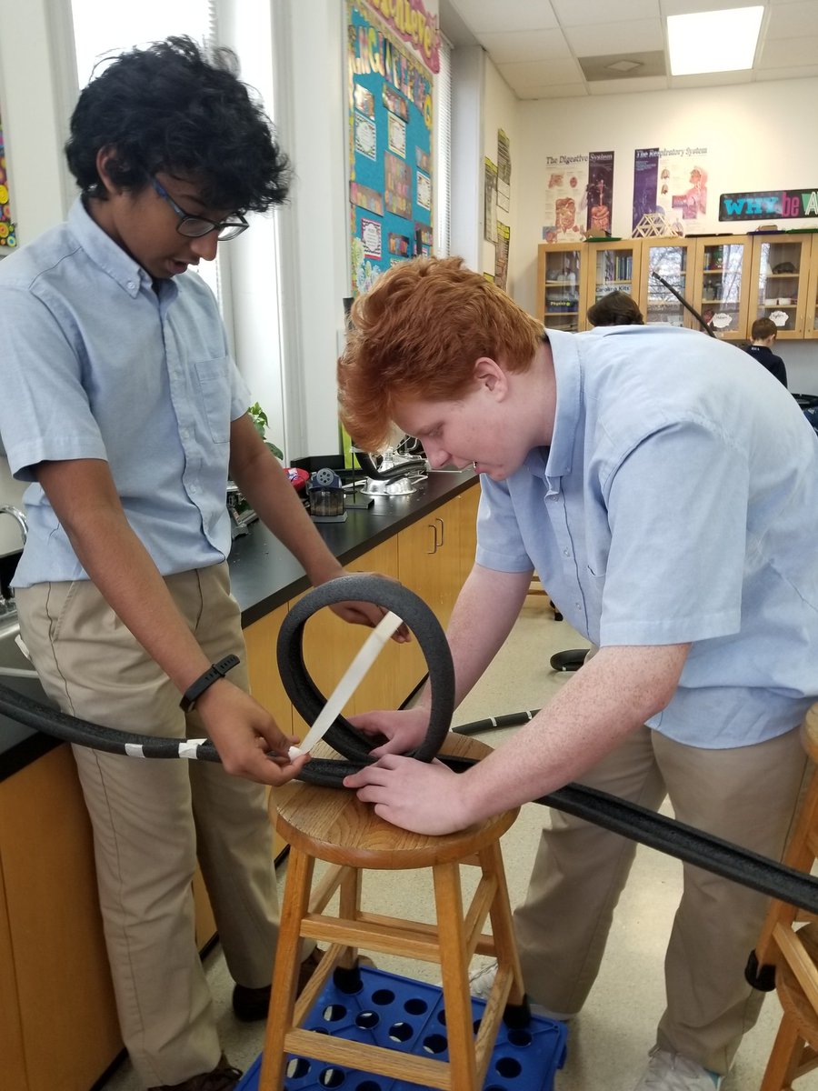AcademySCI's tweet photo. Seventh Class are applying  concepts of force and motion by engineering rollercoasters. They are using a combination of gravity and inertia, along with g-forces and centripetal acceleration to create an exhilarating ride.  #STEM @ash1818 https://t.co/szBHhcCkga