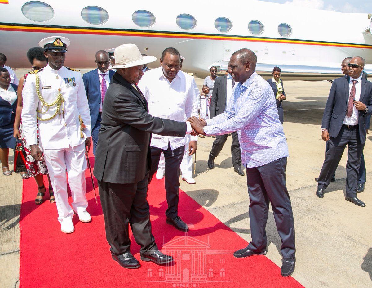 Image result for museveni shaking hands with Ruto