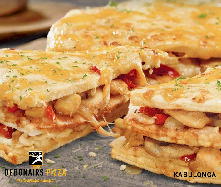 JohnnyCrypto_1's tweet photo. Have you tasted our triply-tasty Triple-Decker Debonairs Pizza? It's three cheesy layers of our secret cream cheese, chicken, fresh tomatoes, and mozzarella topped with sweet chilli sauce and a sprinkle of parsley. Dinner is served. Anybody interested??? https://t.co/TJqTMJs6os