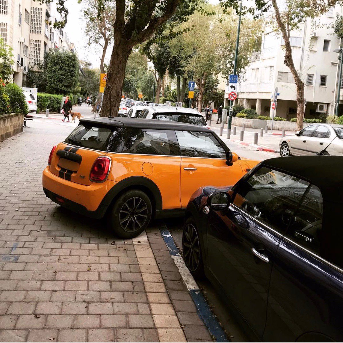 You don't have to try and squeeze your car into just any space.  With Parqueo, you can rent your space from someone that has a parking space a little more suitable for your vehicle.  Thanks, @parkingtlv  for the epic photo!  <a href="/MINI/">MINI</a> #parking #reservedparking