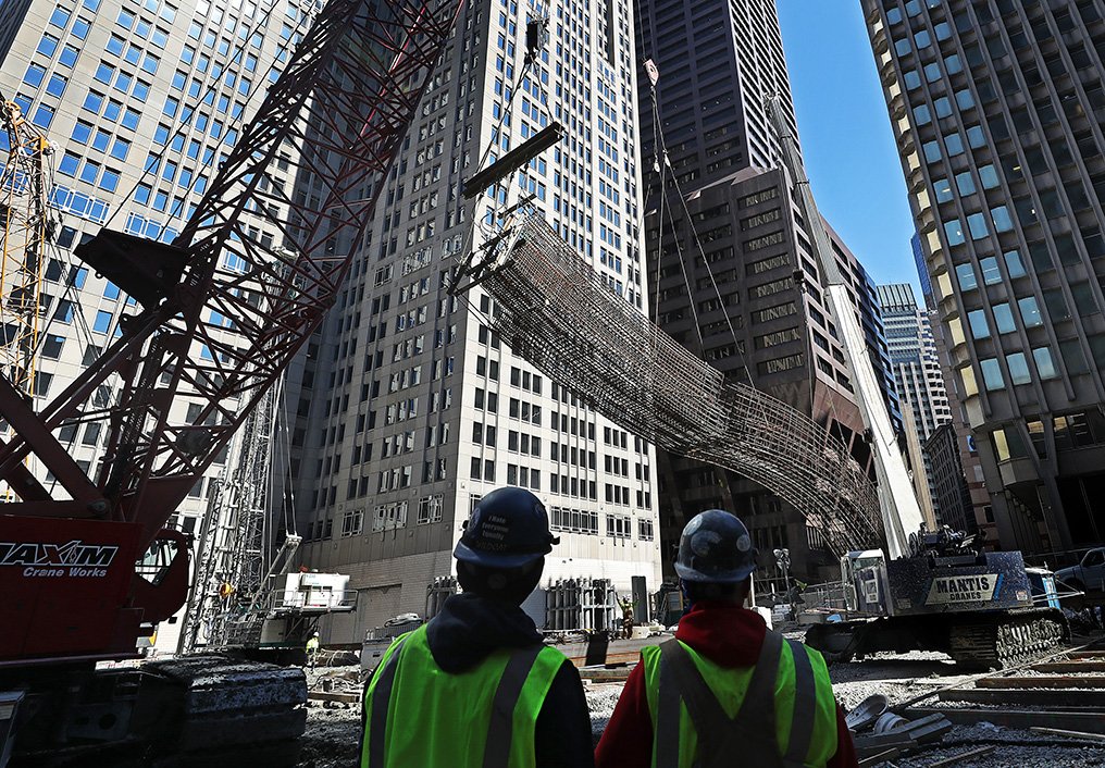 UNDER CONSTRUCTION...Winthrop Center will feature two glass-and- concrete spires full of office space and condos stacked on top of a massive ground-level hall that will connect Federal and Devonshire streets.