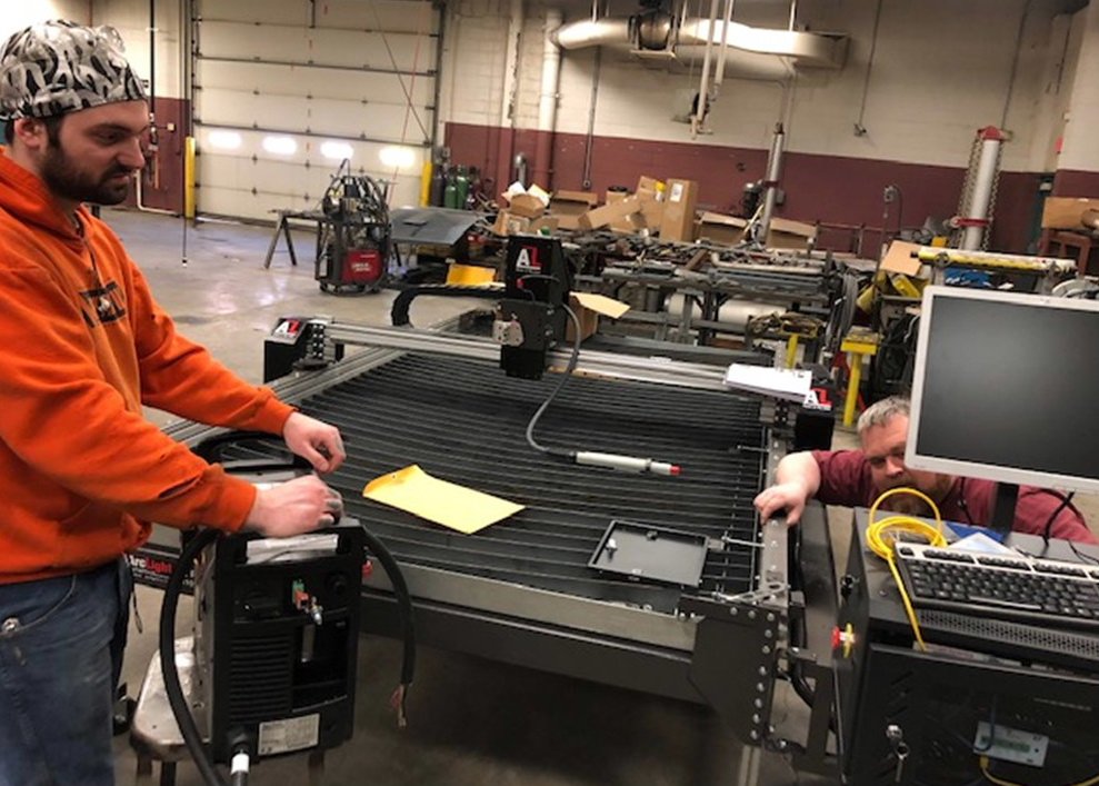 nacco15's tweet photo. Student Blake (left) and Welding Instructor RJ Rowland came into the welding shop today (and during their Spring Break) to herald the arrival of a high-tech Arc Light CNC plasma welding table @DanvilleAreaCC Vermilion Healthcare Foundation provided a grant to purchase the table. https://t.co/b0DUECUapS