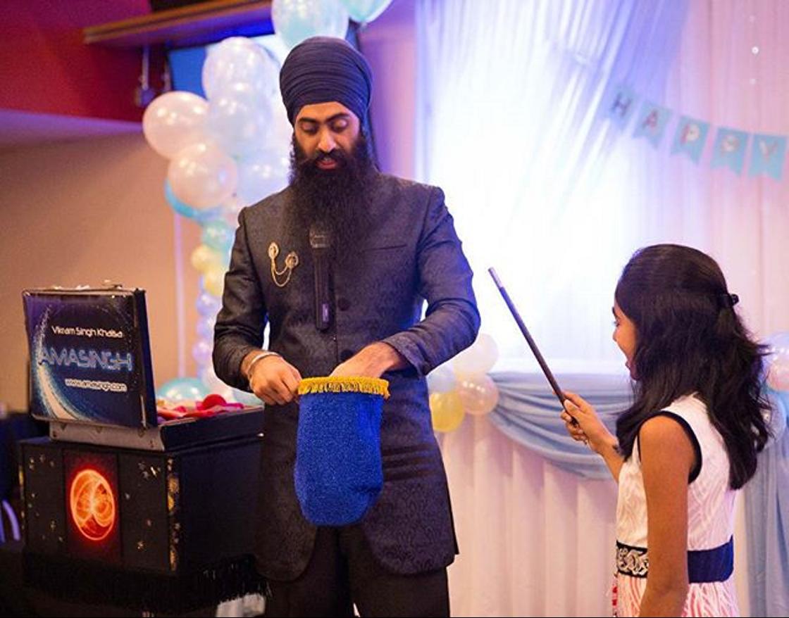 AmasinghMagic's tweet photo. Almost got turned into a rabbit! You have to be careful when your volunteer has the magic wand.. you never know what these kids might do. #amasingh #amazing #magic #magicshow #magician #kids #children #entertainment #sikh https://t.co/lzLxmn313o