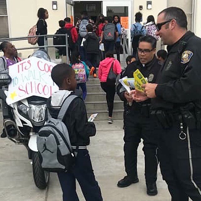 LBPD's tweet photo. Our #LBPDMotors welcomed students at Willard Elementary School this morning and reminded them that “It’s Cool To Walk To School.” 🚶‍♂️🚶‍♀️ #LBPDCares #CommunityPolicing #WillardElementary #ItsCoolToWalkToSchool #MoreThanJustTickets #PublicSafetyThroughPartnerships https://t.co/hBH6ykkNJt