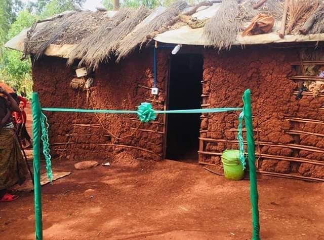 AfricaFactsZone's tweet photo. An electricitified mud house being commissioned with Engineers on site. https://t.co/hFvUqsJhgs