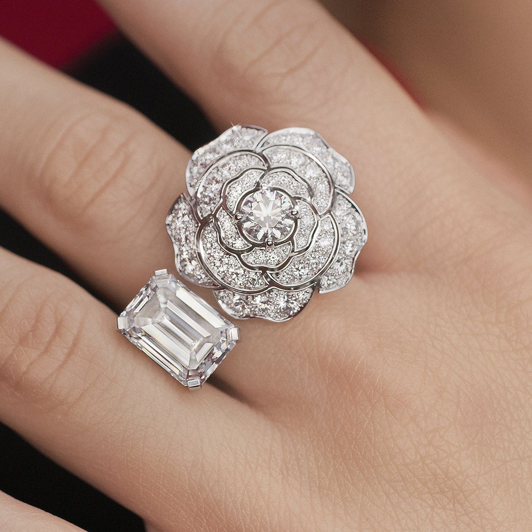 CHANEL on X: The lines of a five-carat, emerald-cut diamond of the  Contraste Blanc ring are juxtaposed with the petals of a diamond-encrusted  camellia, part of the 1.5 — 1