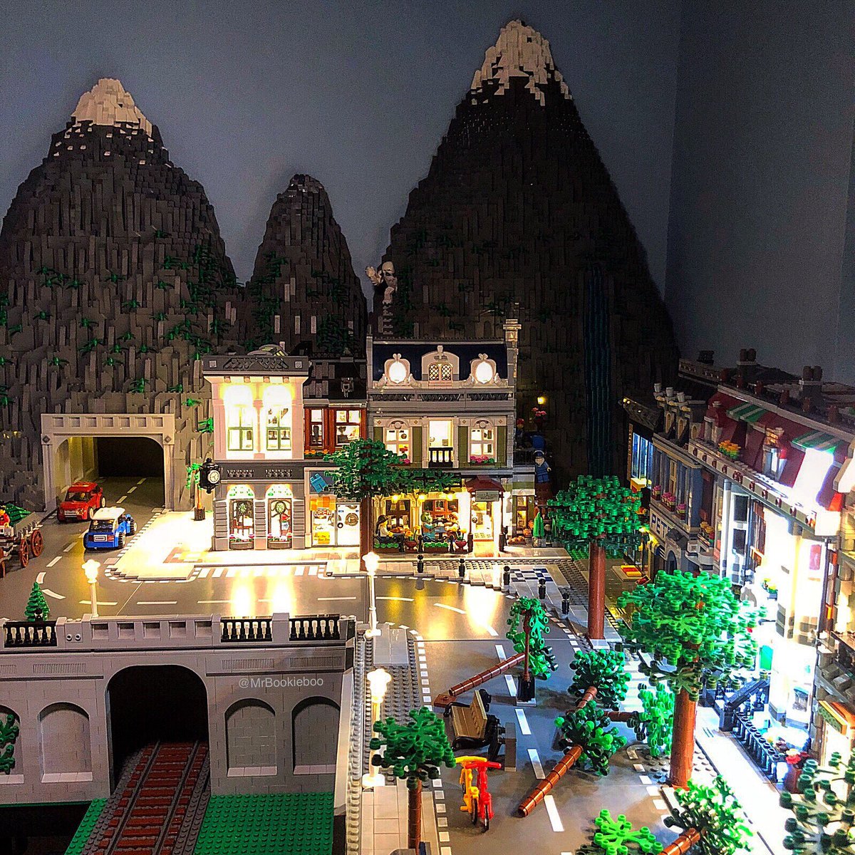 MrBookieboo's tweet photo. Straight-on view of the mountains. Don’t mind the tipped over trees in the foreground, I’m still planting 😂 #moc #lego #legophotography #lego_hub #legoaddict #brickshift #ToyArt #toycommunity #legocommunity #minifig #minifigures #legos #legomoc #legocity #legocitylife https://t.co/MJRHcWWJIn