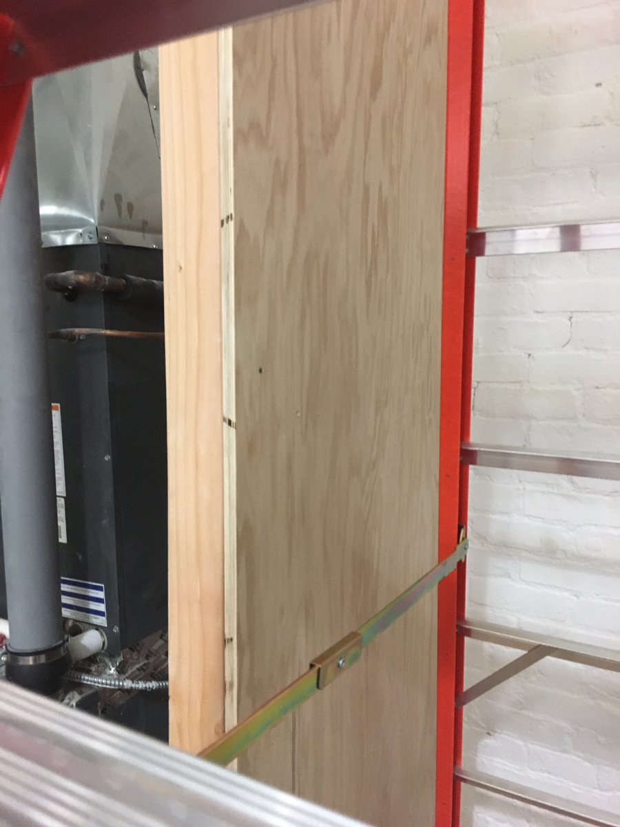 JPGLegal's tweet photo. Our HVAC system is very loud, so Managing Attorney @jeremypgreen is "managing" it by building walls and an access door out of two-by-fours and oak plywood.
#OfficeDIY #OfficeBuildout #DumboOffice #lawfirmlife https://t.co/jUpoHiqZ8o