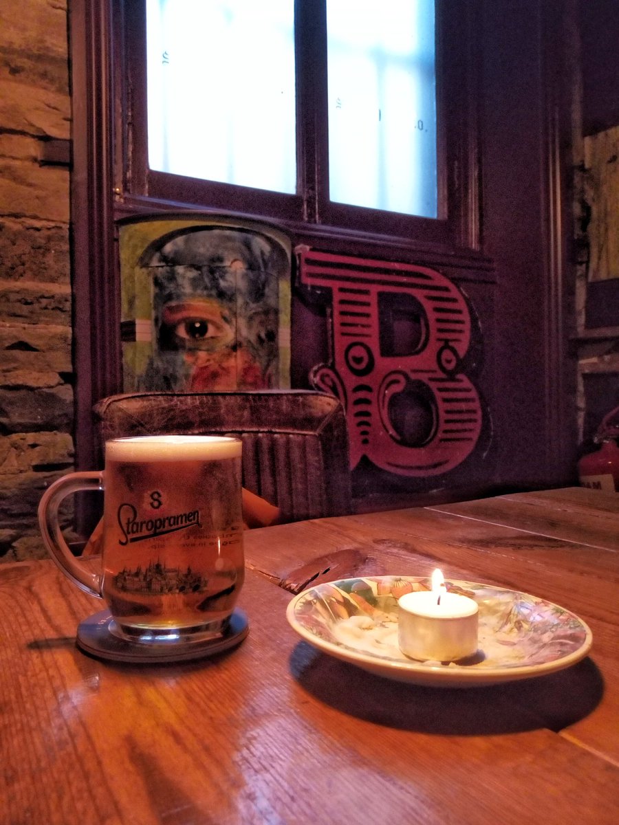 absurdlyso's tweet photo. on form: the now legendary half pint glass of #staropramen @BrickBoxRooms art in pubs #bradford #theartofpubs #aesthetix #ivegate #candle #thehobbit #drinkinghobbit adventures in pubs; favourite beer glasses #formandcontent https://t.co/vKKeShFoh9