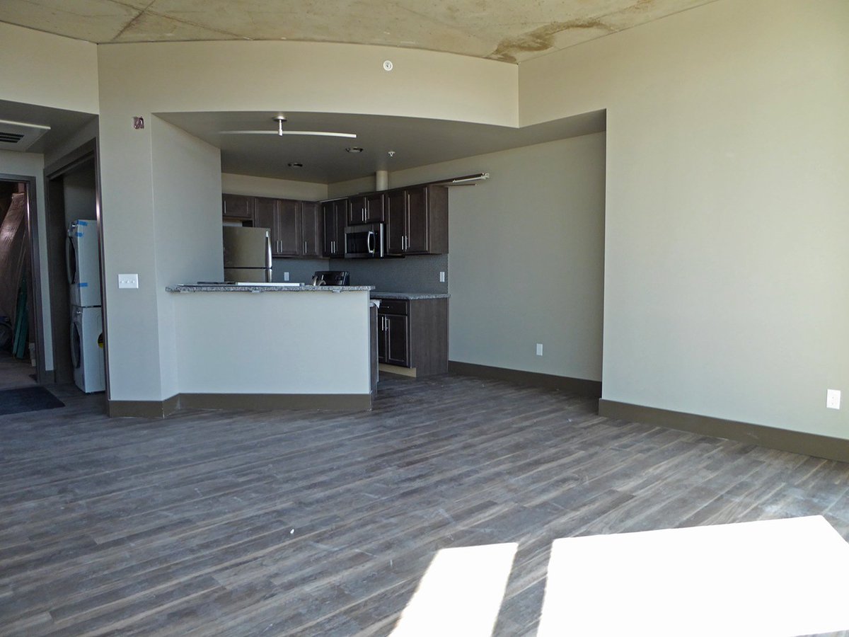 The 1 Bedroom, 1 Bathroom, Premium Sunset View Apartment at The Exchange offers a unique feature for tenants with curved curtain walls that extend from the floor to ceiling. This allows for beautiful panoramic views of the downtown cityscape!  #ByceAssociates #DiscoverKzoo