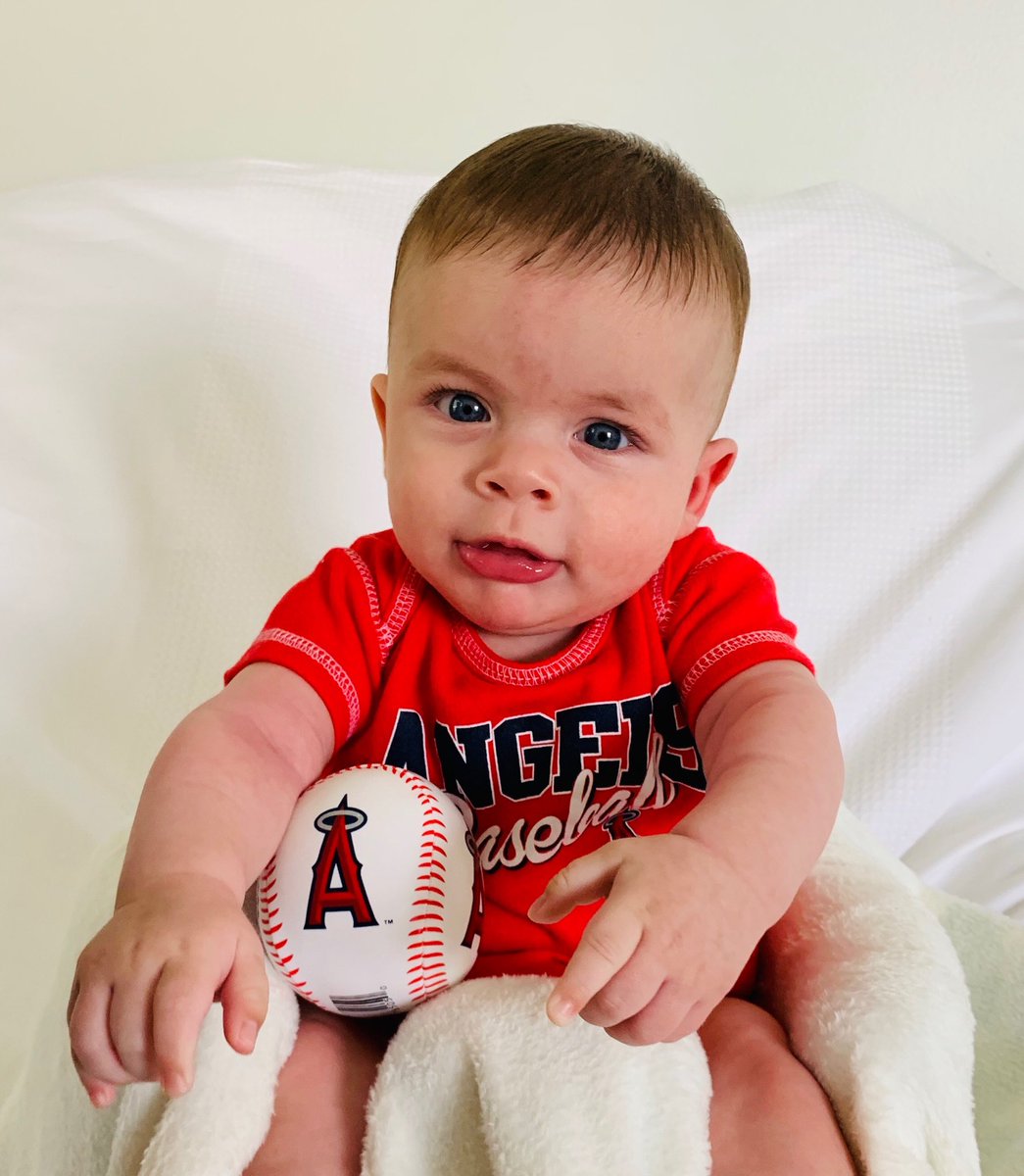 TMead2002's tweet photo. So, this #OpeningDay thing Grandpa has been talking about since Nov. 6th has finally arrived. Judging by what the #Loganator was asked to wear, I now understand the importance! #Angels2019 โฆ@MLBโฉ https://t.co/B0BsA3R6dF