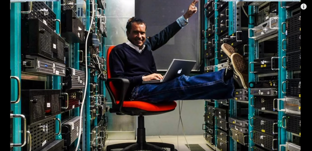 photo of a person in a data center, with Richard Nixon's face and arm photo-shopped on