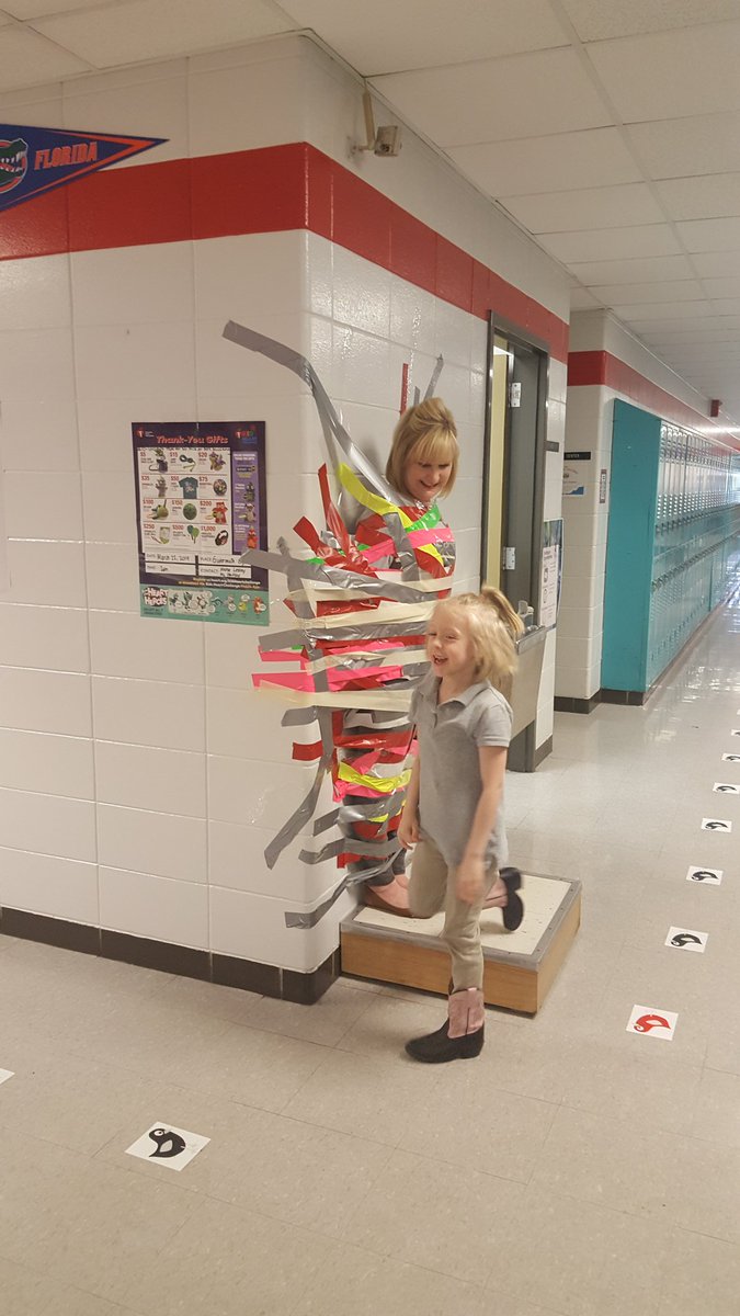 FrcGutermuth's tweet photo. The HYPE of the day at Gutermuth Elementary School was taping the Principal, Laura Mullaney and Nick Scholle, PBIS Coach to the wall for Heart Healthy Heroes. Our student's raised $1,524.00 towards saving lives! @JCPSKY, #GutermuthPride, #wearejcps and #Jcps_FRYSC! https://t.co/ZzNOxL7Jt0