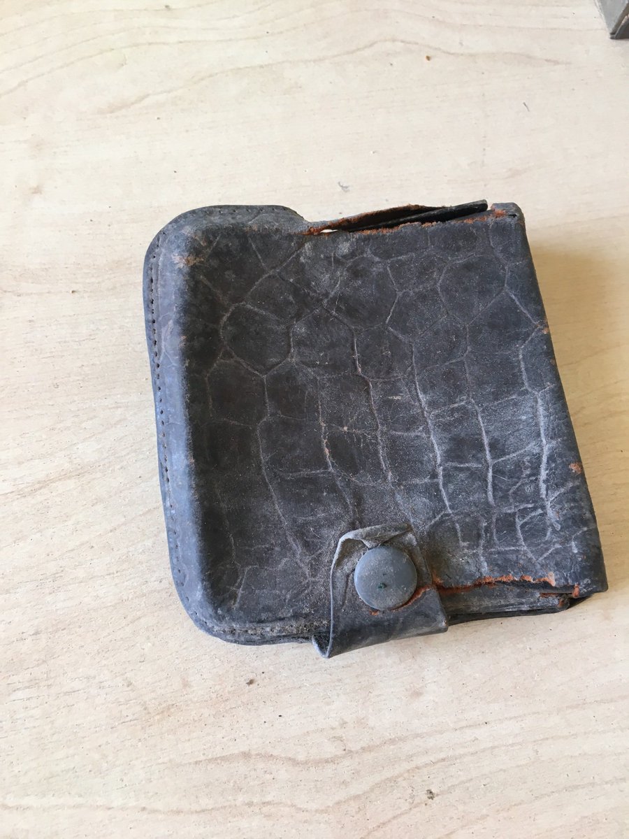 Can anyone date this leather pouch with 2 cigarettes? <a href="/MuseumofEnfield/">Museum of Enfield</a> <a href="/MuseumofLondon/">MuseumofLondon</a>