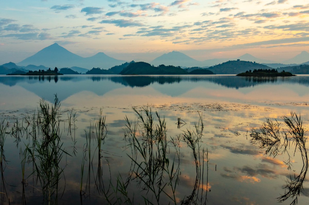 drthomasfalls's tweet photo. Twilight at Lake Mutanda, Uganda with beautiful volcanoes in the background. #uganda #africa #travel #landscape #sunset #canon #teamcanon @BambooEcotours https://t.co/QGiVT4Z5E9