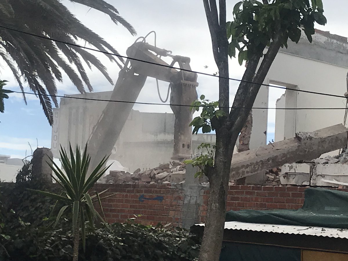 The wall is now down! Heavy demolition machinery is now being employed to knock the building down. The dust is unbelievable. No shade netting is erected along the boundary to mitigate against the dust as was promised by developer. <a href="/CityofCT/">City of Cape Town</a> has done nothing. <a href="/Our_DA/">Democratic Alliance</a>