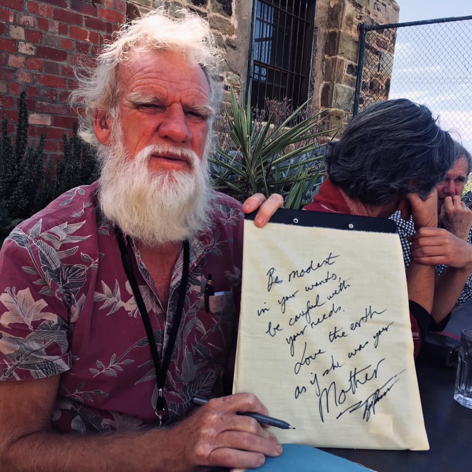ClimateFlags's tweet photo. The wisdom of Bruce Pascoe, author of #DarkEmu. Bruce wrote his #climateflags message in Castlemaine after his panel conversation at the @statefestival #ClimateAction #ClimateChange https://t.co/JygyDH0VZ3