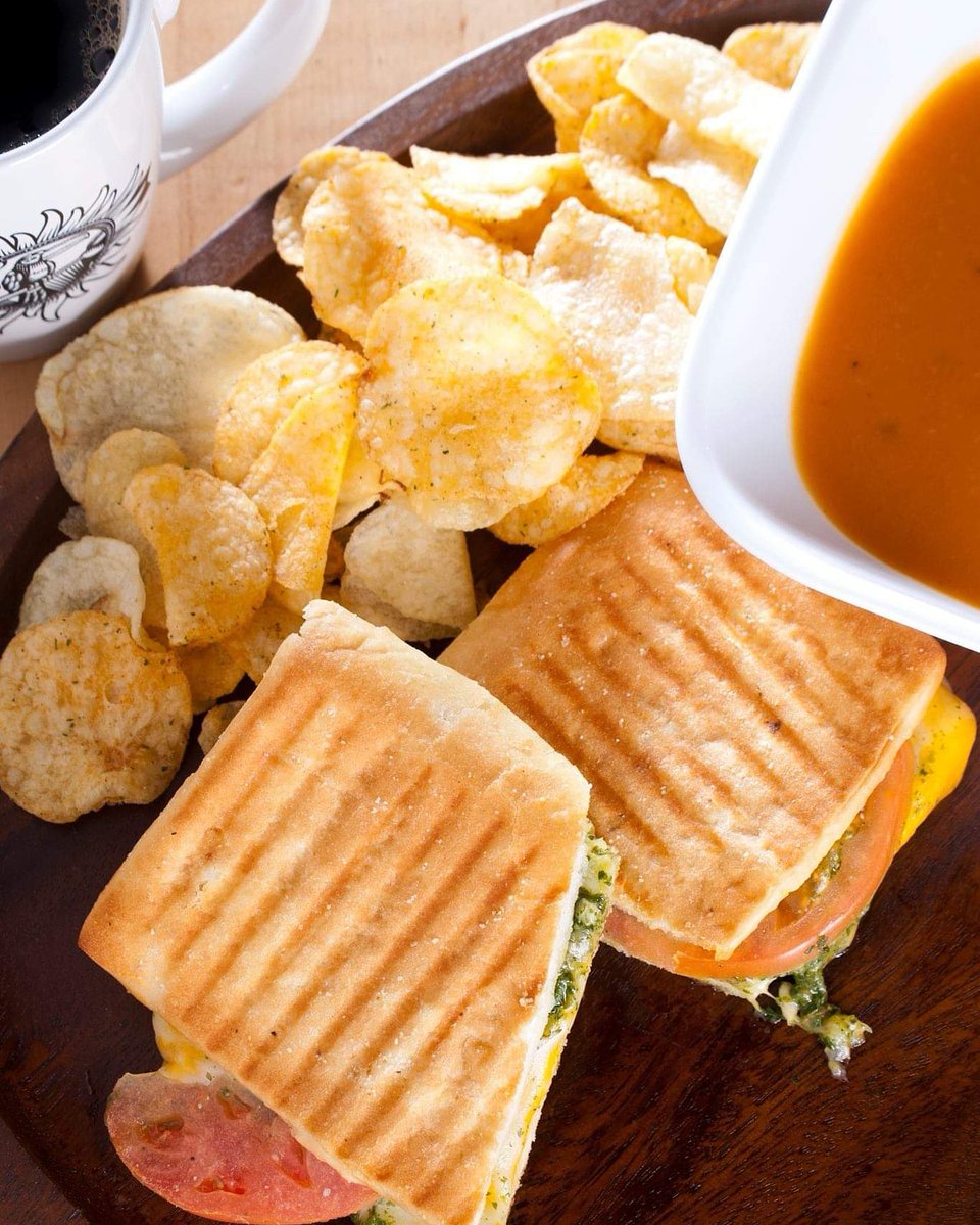 It's national grilled cheese day! Have you tried our soup and sandwich combs? This is our gourmet grilled cheese sandwich. It's a tomato, pesto grilled cheese on focaccia. #nationalgrilledcheeseday #gourmetgrilledcheese #erc #soupandsandwich #tomatopesto #cafelife #coffee #lunch