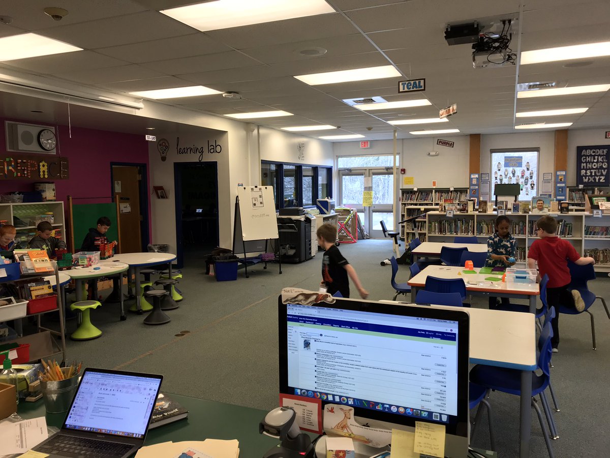 ReadRoadrunner's tweet image. Kindergarten in Learning Lab, 2nd grade drop-in Makerspace centers, small group of students checking out books, and working on teacher request of gathering books for 5th grade book clubs; the library at its best! #futurereadylibrary