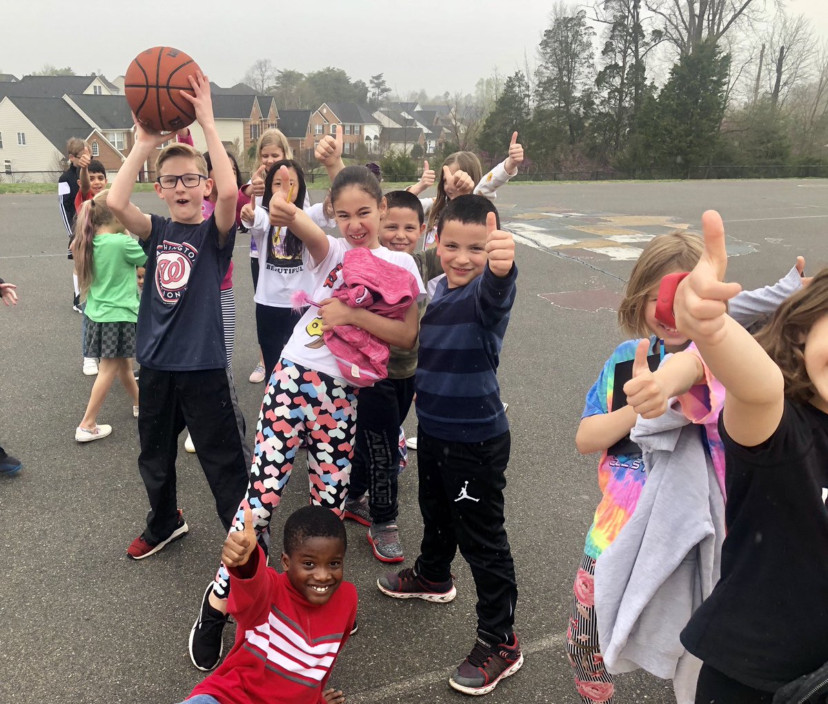 A few raindrops didn’t stop us from going outside and playing a game of basketball with friends!