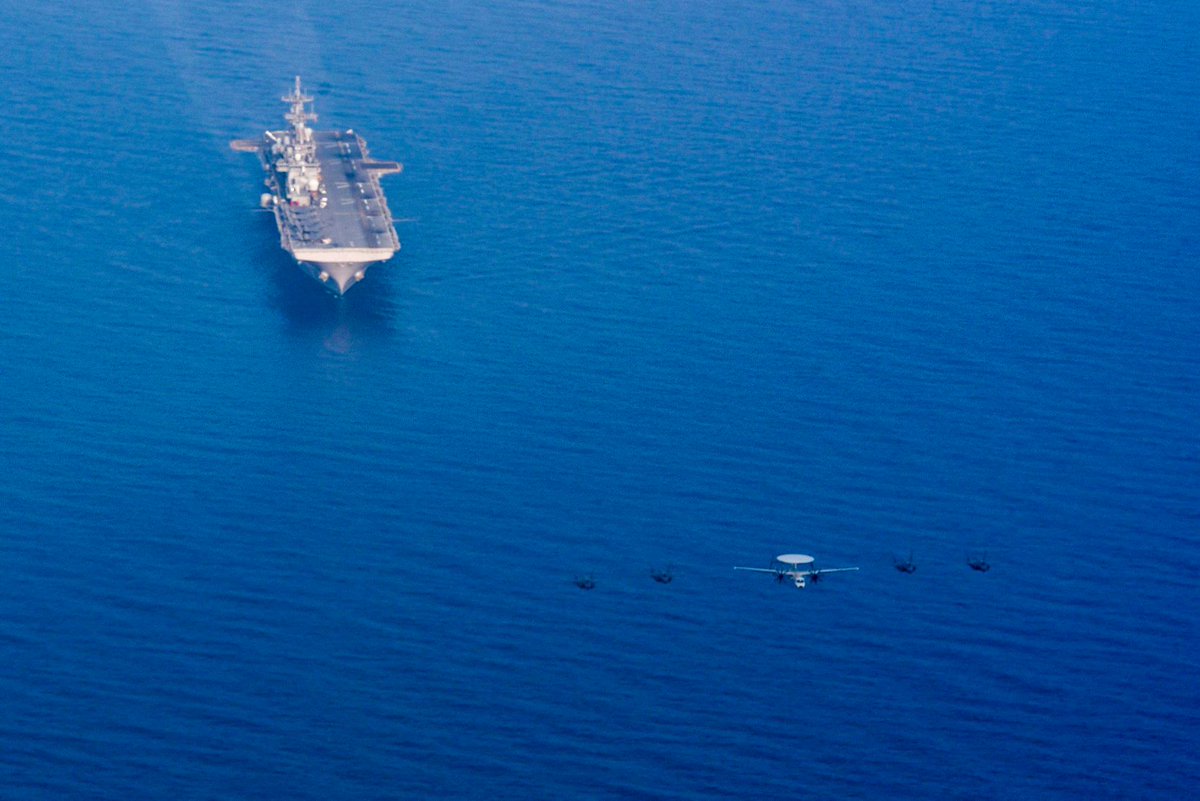 An E-2D Hawkeye, assigned to VAW 125 Tigertails, and F-35s, assigned to Marine Fighter Attack Squadron (VMFA) 121, fly in formation over #USSWasp during Exercise Balikatan 2019! #USNavy #USMC #NavyPartnership #NavyReadiness #NavyCapacity #ExerciseBalikatan