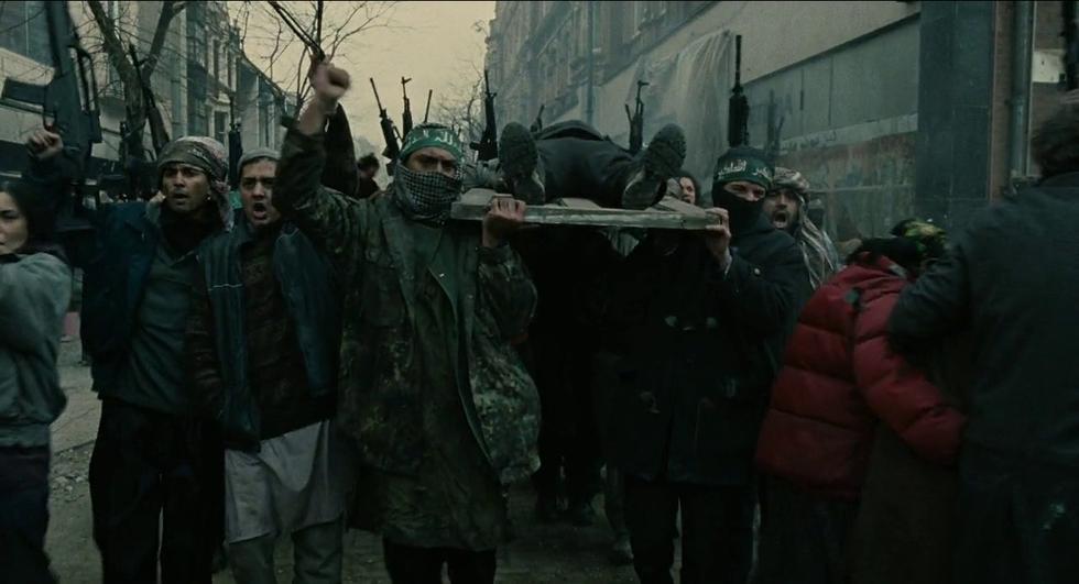 ENGLAND 2024Fighters of the Galloway Martyrs Brigade (لواء شهداء غالوي, Liwa Shuhada Ghalwy) mourn a fallen comrade in the embattled streets of Manchester, unfazed by the RAF bombers streaking overhead or the nearby rumble of shot and shell.