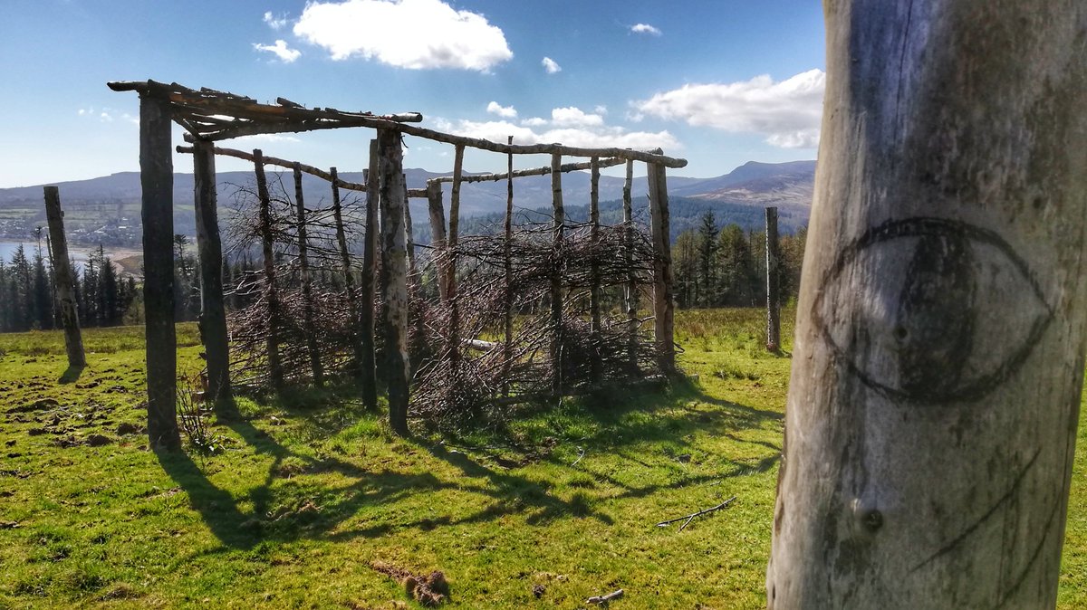 gmacg_1's tweet photo. Charred remains of the @TeamBuildNBurn timber structures are still standing on the hillside. 

@urbanprehisto @aura_bock  #IsleOfArran #CreativeArchaeologies https://t.co/TOna9IPkLq