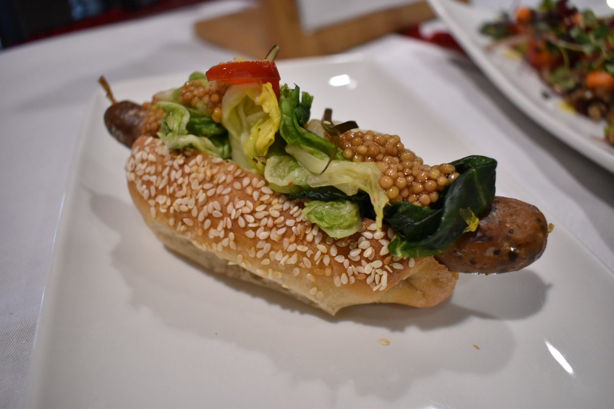 CarletonDining's tweet photo. We're at the Flavours of Canada Event at @UMassDining Check out our hand made Outaouais's Lamb and Pork Sausage on a pretzel bun! RETWEET if you think we should make this at the mix when we get 🏠 #flavoursofcanada #umass @Carleton_U @CarletonFoodie https://t.co/cufT3tGWH9