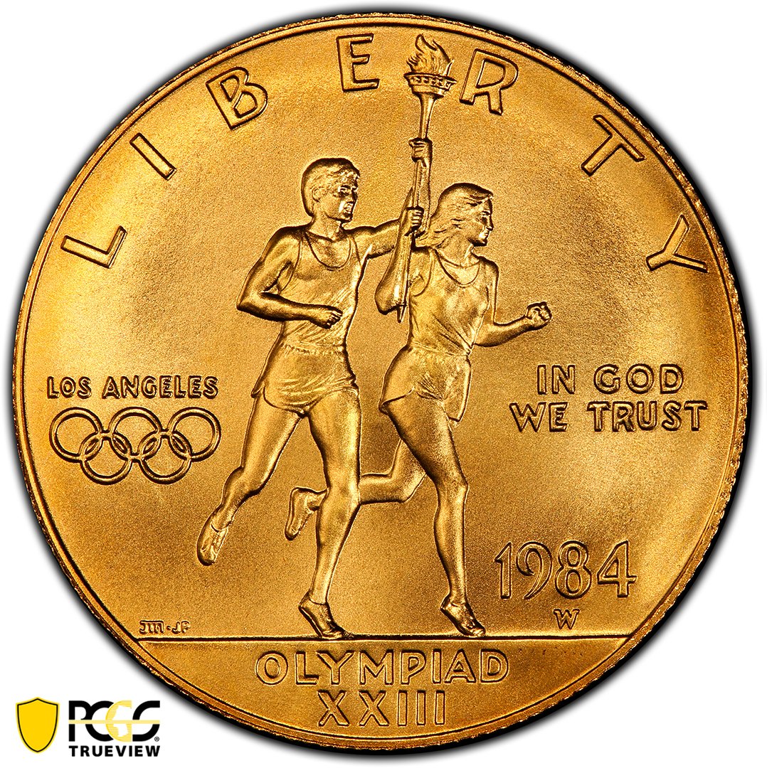 PCGScoin's tweet photo. Despite the facility producing #coins throughout much of the 1970's, the #Wmintmark, grabbing so many headlines lately, didn't appear on a coin until the 1984 #Olympics Ten Dollar Gold Commemorative (seen here #PCGS MS70). https://t.co/H2vV7dQa59
