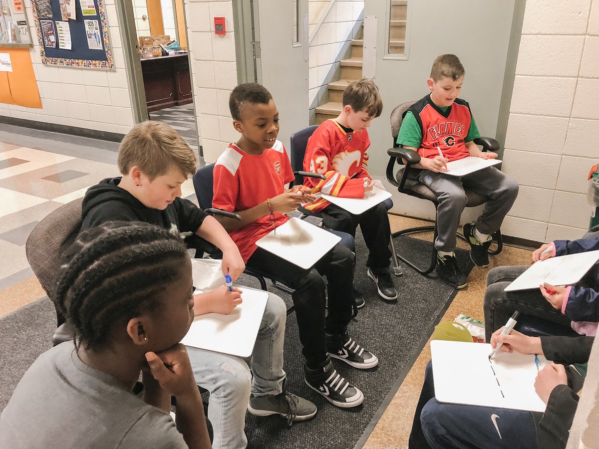 Gr 5 and 6 students hosted RED MILE MATH in their hallway this morning. So fun for students (K-6) to work on math skills &amp; games while getting excited to cheer for our fav team!  #GoFlamesGo @PalliserSchools <a href="/NHLFlames/">Calgary Flames</a>