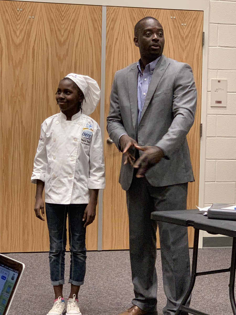 cville_schools's tweet photo. Chef Ulysse Charles is celebrating the winner of the recent Sodexo Future Chefs competition, Makayla Young from Bailey Station Elementary School.  Makayla is also a regional winner and in the running for the national competition.  Congratulations!!! @ChefUlysse  @BaileyBears05 https://t.co/Z2nNNbdkOE