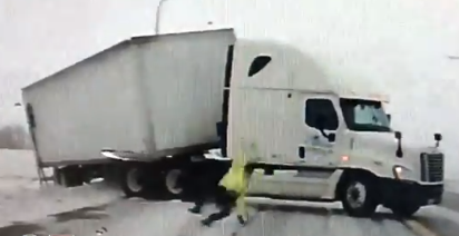 StarTribune's tweet photo. Wiped out by the wind, Minnesota State Patrol trooper gets right back up to do his job. https://t.co/vbpdDiP5WS https://t.co/cVn6iSxIY7
