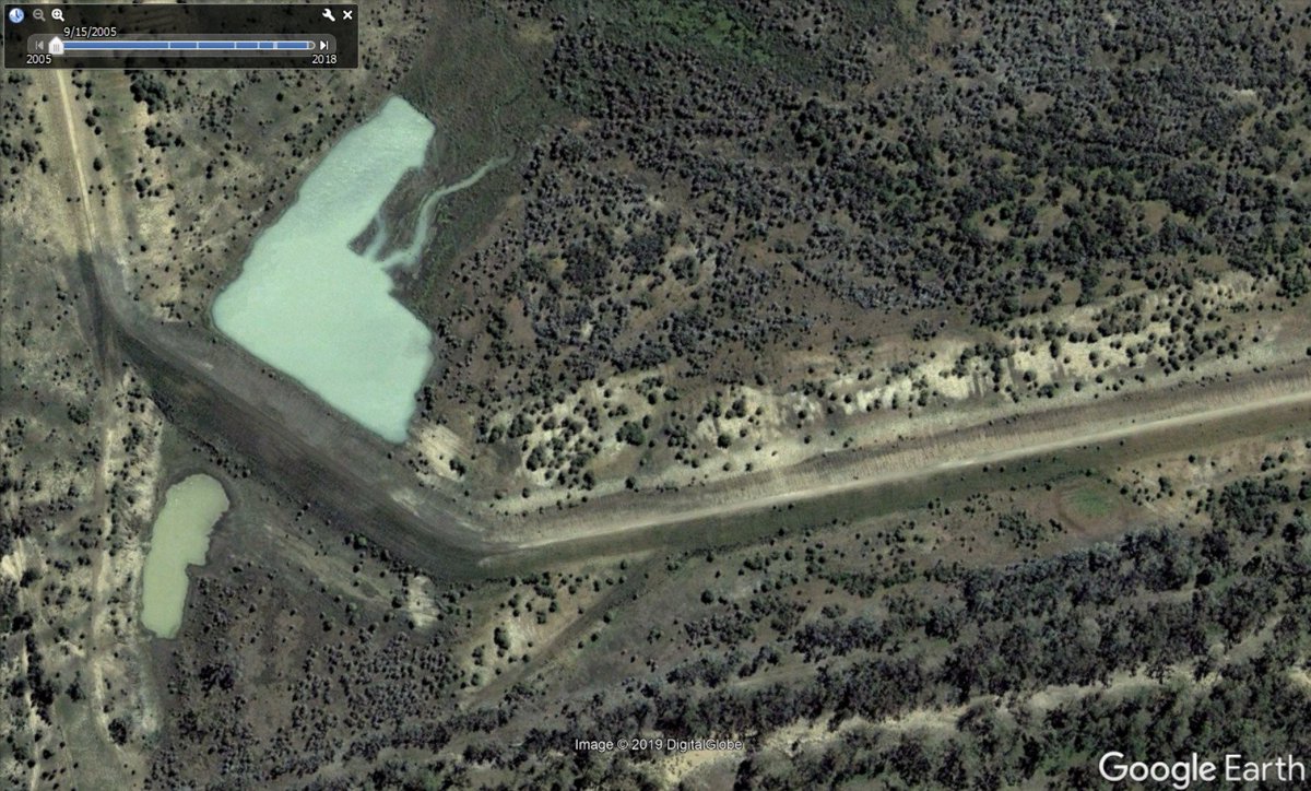 There is a breach in the levee 500m east of the dam, perhaps intended to provide a spillway (there is no other). It was made between 2005 and 2011. Apart from that, all of the flood harvesting infrastructure appears to be intact.Spillway retrofit (?) -- 2005 left, 2011 right: