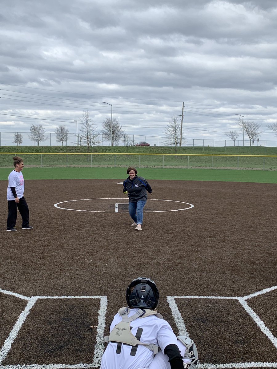 GEHS vs Olathe West come together for Pink Out Night!!  Pam is a SURVIVOR!!   Nice Pitch! 🥎 🤘#thankyouOWLSoftball #CancerControlMonth #firstpitch