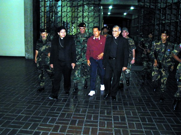 DolarToday's tweet photo. CHAVEZ YA DE MADRUGADA DEL 12 DE ABRIL CAMBIADO DE CIVIL, CON SU SEGURIDAD PERSONAL DE LA CASA MILITAR SALE ACOMPAÑADO DE LOS MONSEÑORES ASUAJE Y PORRAS Y HASTA SONRÍE ?QUE TAL? LO MALTRATAN? LO SECUESTRARON? https://t.co/fXEUZBn7YQ