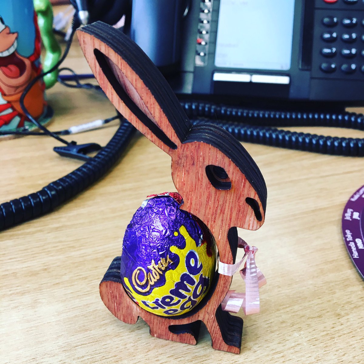 Wales_Cerys's tweet image. This little guy has gone down a storm in the office this morning! Thanks to the very talented pupils of @YsgolYDeri #designstudents #easter #enterprise #chocolate