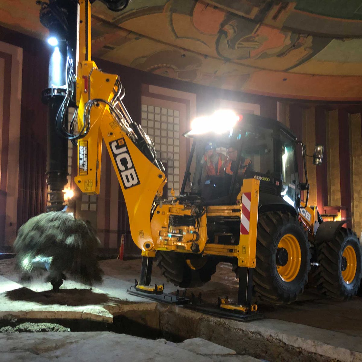 JCBmachines's tweet photo. This Pilingmaster was drafted in to work inside the Vision Theatre, Los Angeles! The machine squeezed through a 12-foot tall doorway, and drilled 20-foot piles indoors, on an uneven surface where the tiered seating used to be! #AmazingApplication https://t.co/VDsv5a9kdU