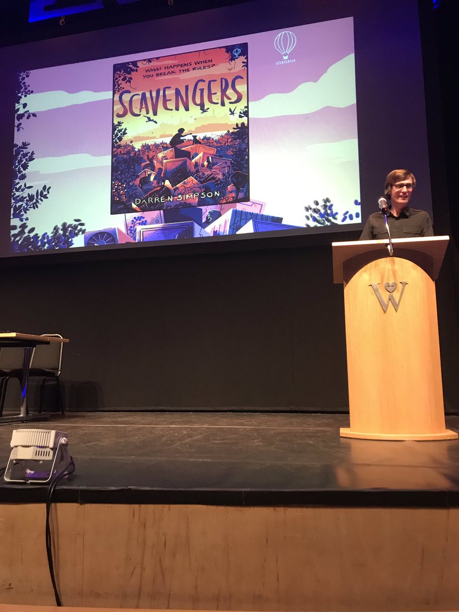 Usborne's tweet photo. Scavengers author @DarrenSimpson44 has taken to the stage at #FCBGConference 📚📚📚 https://t.co/GgGbg0V1p3