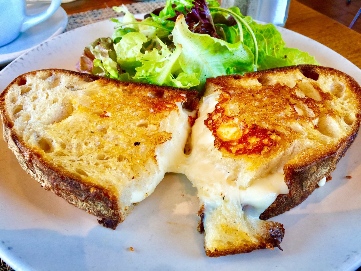 AustinCheeseCo's tweet photo. Happy National Grilled Cheese Day!  This is our Artisan Grilled Cheese sandwich! Made with sourdough bread with Parmesan cheese spread, Gruyere, Fontina, and Asiago cheeses. Guaranteed every bite to be melty and delicious.
#austincheeseco #nationalgrilledcheeseday https://t.co/7MFHbwaEbL