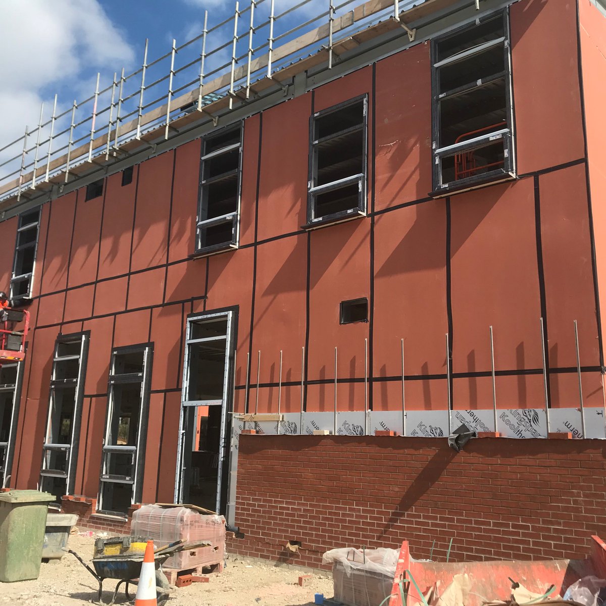 StTheresasICL's tweet photo. Some more shots of the progress down at St Theresa's. West elevation windows and brickwork advancing well. Roofing insulation and top sheet works well underway too. @IRVconstruction https://t.co/mfY6AFXwKI